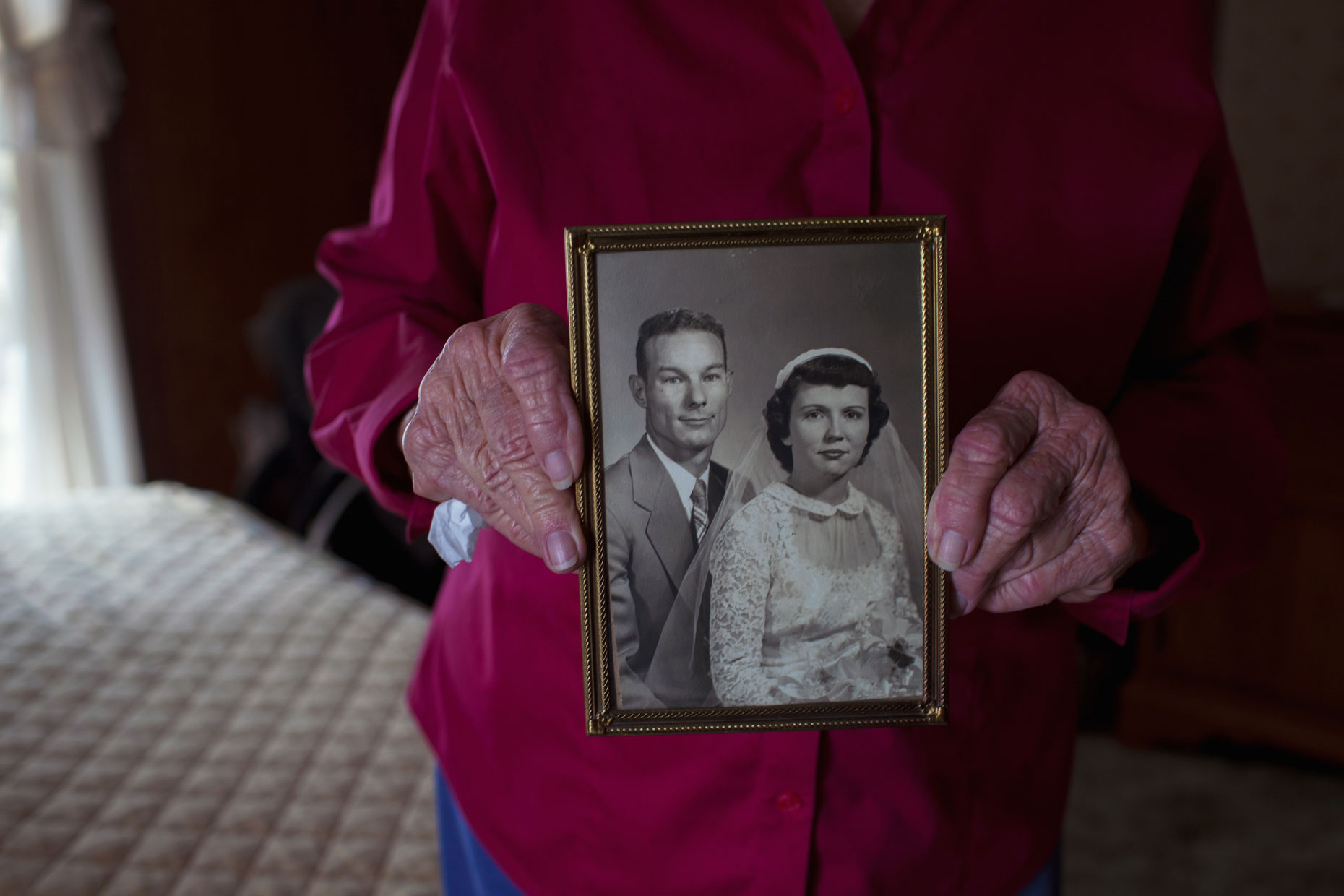 Woman holding wedding photo in the Texas Panhandle